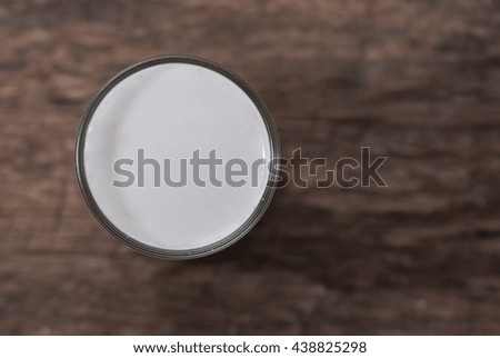 Coconut on a wood background.coconut milk
