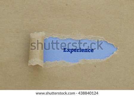 experience word written under torn paper.