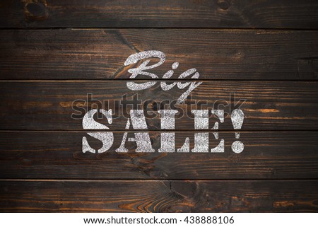 word Sale written on a old vintage wooden plate