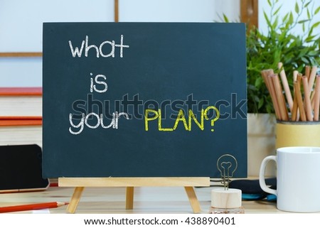 what is your plan ?-  text / message on the blackboard with the background of stationary on the office desk. the start-up  management concept