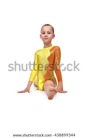 Little girl gymnast sitting on split on a white background