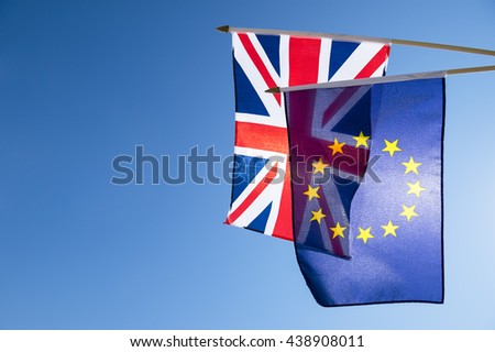 European Union and British Union Jack flag flying in front of bright blue sky in preparation for the Brexit EU referendum Royalty-Free Stock Photo #438908011