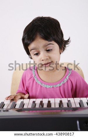 girl playing with keyboard