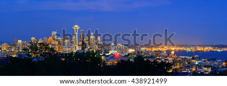 Seattle city skyline at night with urban office buildings viewed from Kerry Park.