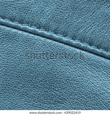 blue leather background decorated with seam