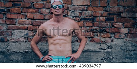 Young man posing in shorts 