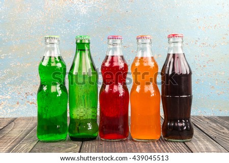 variety of soda bottle on the wooden background
 Royalty-Free Stock Photo #439045513