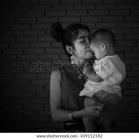 Asian family, Mother holding her baby, hug, mom, fashion, Thai Lanna style, Vintage Style, black and white picture, Grayscale image