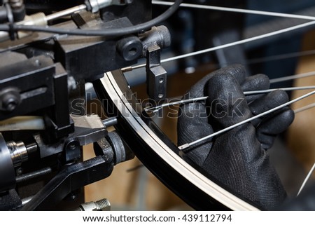 Bicycle spokes service. Man installing  bicycle gear on wheel. 