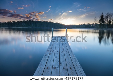 Wooden pier on the lake. Beautiful landscape