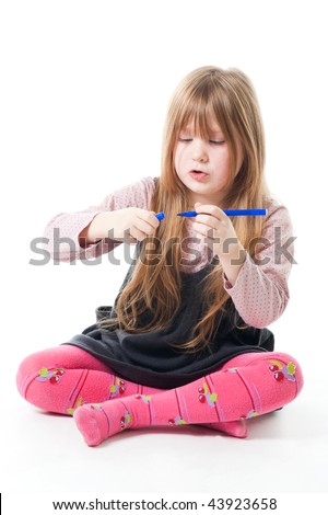 Little girl sit with felt pen, isolated on white