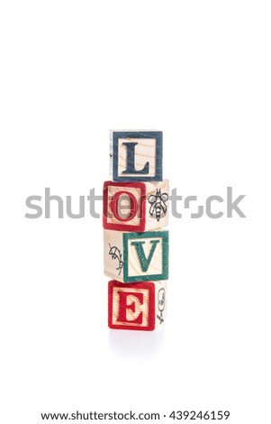 photo of a alphabet blocks spelling LOVE isolate on white background
