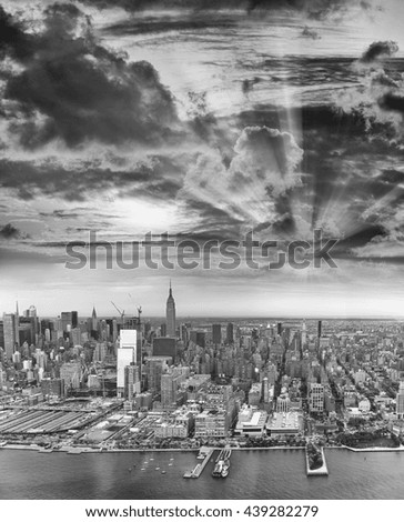 Black and white aerial view of Midtown Manhattan buildings.