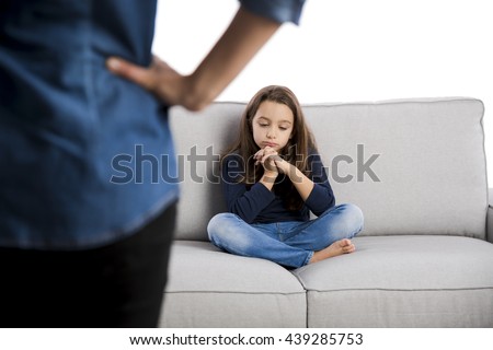 Grown up rebuking a little child for bad behavior Royalty-Free Stock Photo #439285753