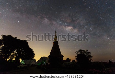 Outstanding high contrast of milky way with star blooming with Silhouette flower garden, brick road and pagoda on Inthanon mountain, thailand, horizontal picture