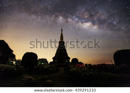 Outstanding high contrast of milky way with star blooming with Silhouette flower garden, brick road and pagoda on Inthanon mountain, thailand, horizontal picture
