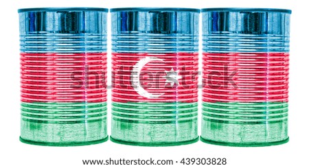 Three tin cans with the flag of Azerbaijan on them isolated on a white background.