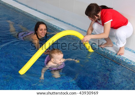 Mum with the son bathe in pool