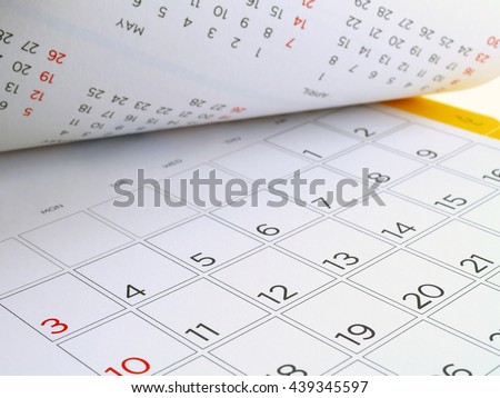 desk calendar with days and dates in July 2016, flip the calendar page Royalty-Free Stock Photo #439345597