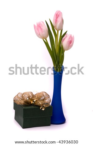 Pink tulips and gift box on a white background