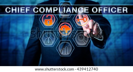 Business executive is pushing CHIEF COMPLIANCE OFFICER on an interactive touch screen interface. Business challenge metaphor for corporate governance, regulatory compliance and corporate executives. Royalty-Free Stock Photo #439412740
