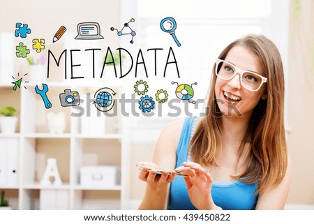 Metadata concept with young woman wearing white glasses using her smartphone in her home 