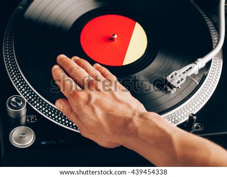 turntable scratch, hand of dj on the vinyl record