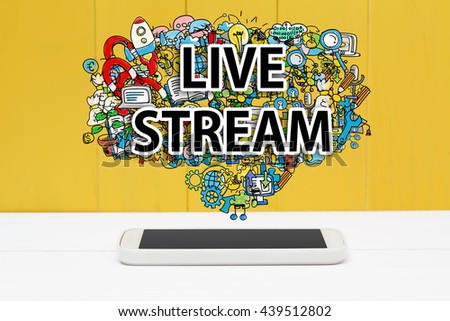 Live Stream concept with smartphone on yellow wooden background