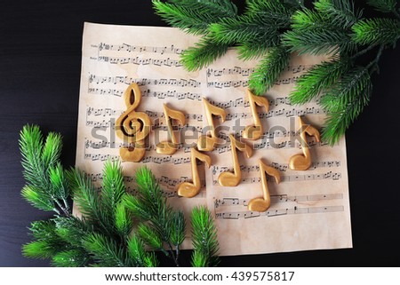 Christmas treble clef and music notes on paper background