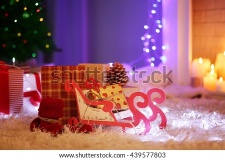 Christmas gift boxes and decoration on the soft carpet, indoor