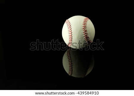 Baseball in black background