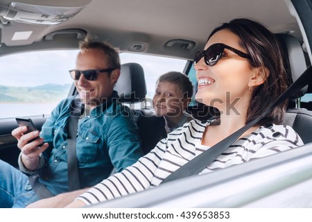 Happy family riding in a car Royalty-Free Stock Photo #439653853