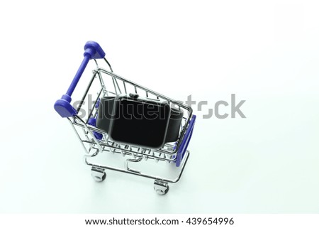 E-commerce Concept. Shopping Cart with Smart Watch on a white background.