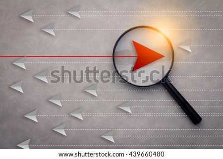 magnifying glass searching for unique leader business success concept