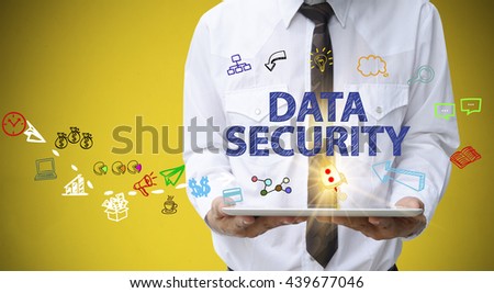 businessman holding a tablet computer with DATA SECURITY   text ,business concept ,business idea