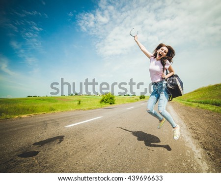 travel tourist . woman hitchhiking 