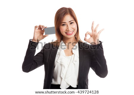 Young Asian business woman show OK with a blank card  isolated on white background