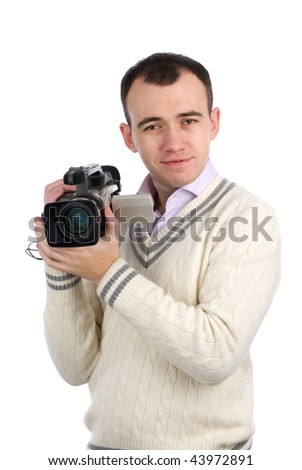 A young man holding a camcorder isolated on a white background