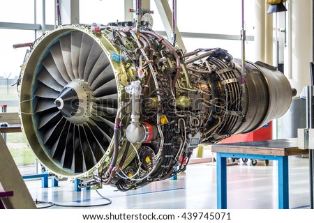 Engine's maintenance in huge industrial hall Royalty-Free Stock Photo #439745071