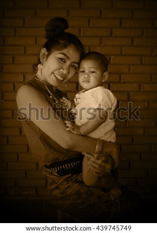 Asian family, Mother holding her baby, hug, mom, fashion, Thai Lanna style, Vintage Style, black and white picture, Grayscale image, sepia color