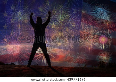 silhouette of a man who show hands over the Multicolor Fireworks Celebrate over the United state of America USA flag background, Independence day concept
