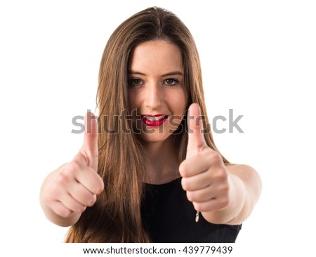 Young girl with thumb up