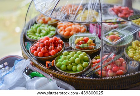 deletable imitation fruits (kanom look choup) on sale in Amphawa floating market, Thailand Royalty-Free Stock Photo #439800025