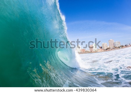 Wave Durban
Ocean wave closeup swimming inside hollow crashing blue water.