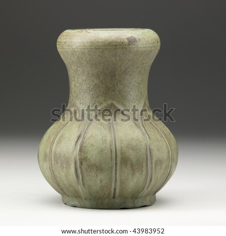 squat pottery vessel on white