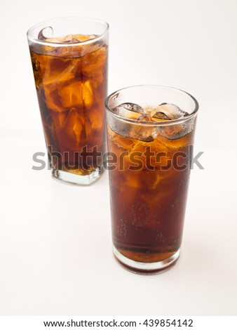Drink cola in glass on white background