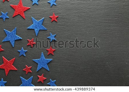 Red and blue stars on slate background