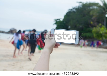 hand holding smartphone white background for text conserve nature . sea background Ecology concept. World Environment Day concept