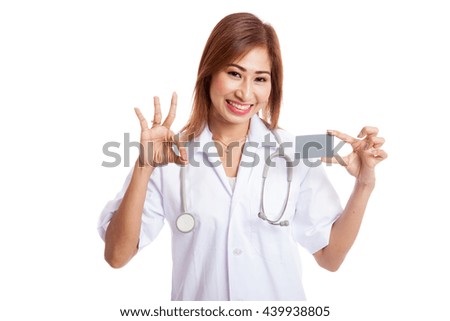Asian young female doctor show Ok sign with blank card  isolated on white background