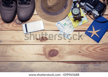 Accessories for travel. Passport, photo camera and travel map. Top view. Holidays and tourism concept